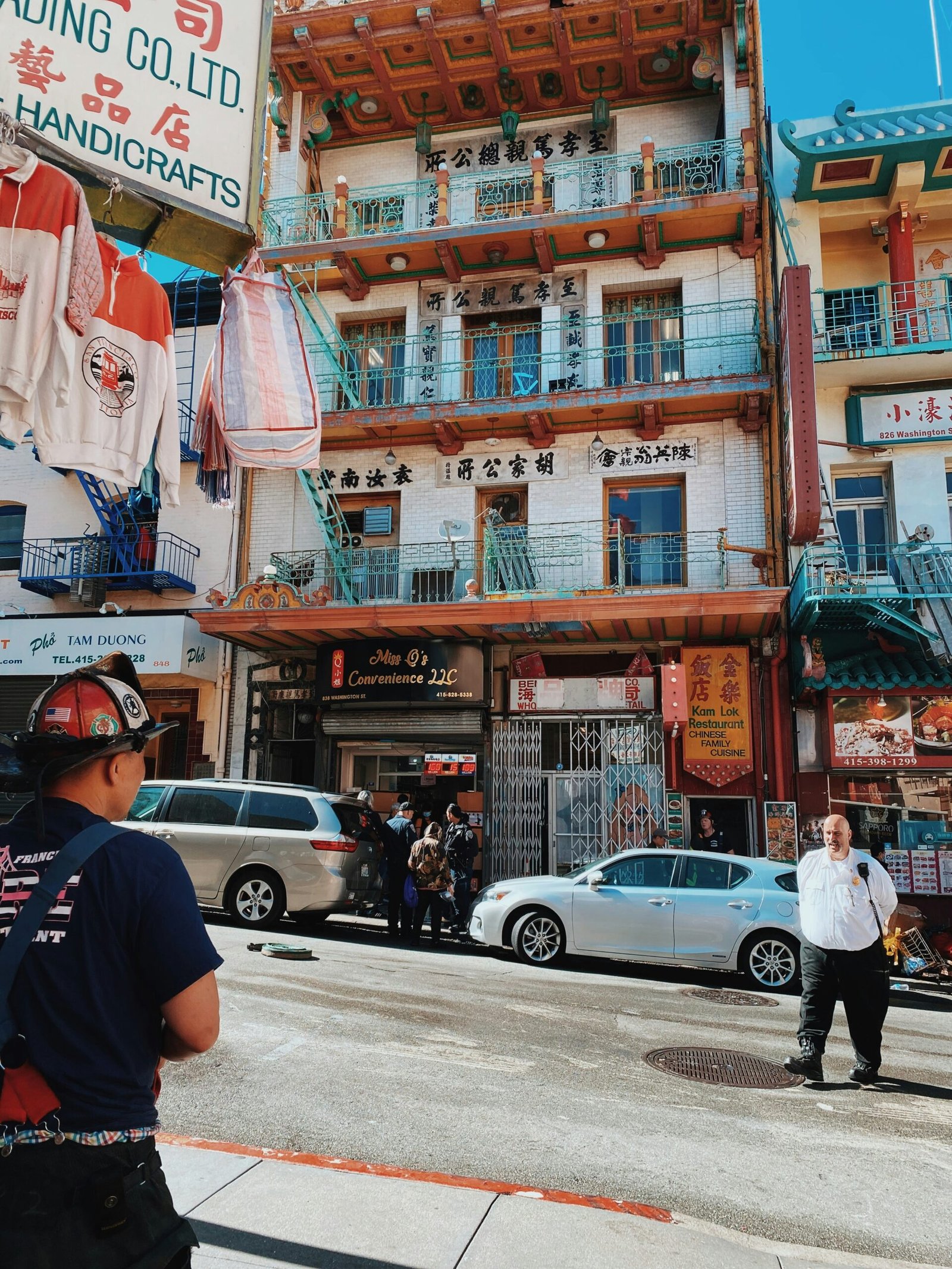 a street with cars and people